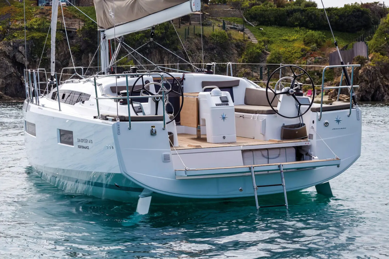 A Jeanneau Sun Odyssey 410 stern-to in a quiet cove